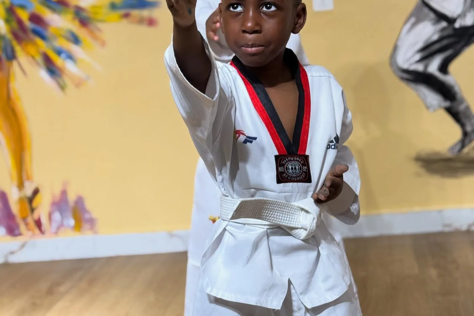 A student in taekwondo uniform during a martial-arts class.